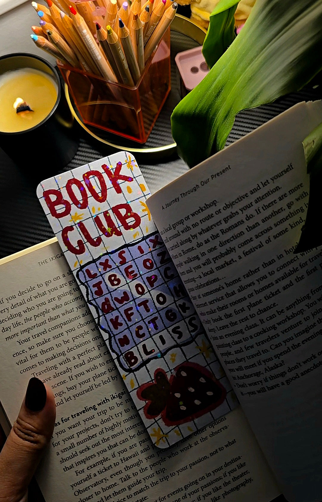Book Club Word Search holographic bookmark in use inside a book showing full design with Book Club title and word search