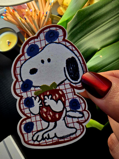 Berry Cute Snoopy die-cut sticker – Snoopy wearing a red plaid blueberry-print outfit, hugging a strawberry, matte vinyl, 2x3 inch
