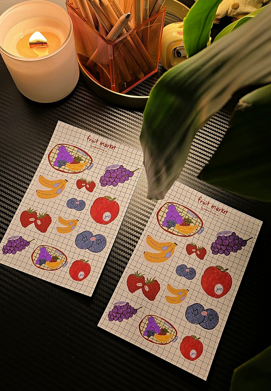 Fruit Market sticker sheet flat lay showing two sheets side by side with fruit stickers on grid background