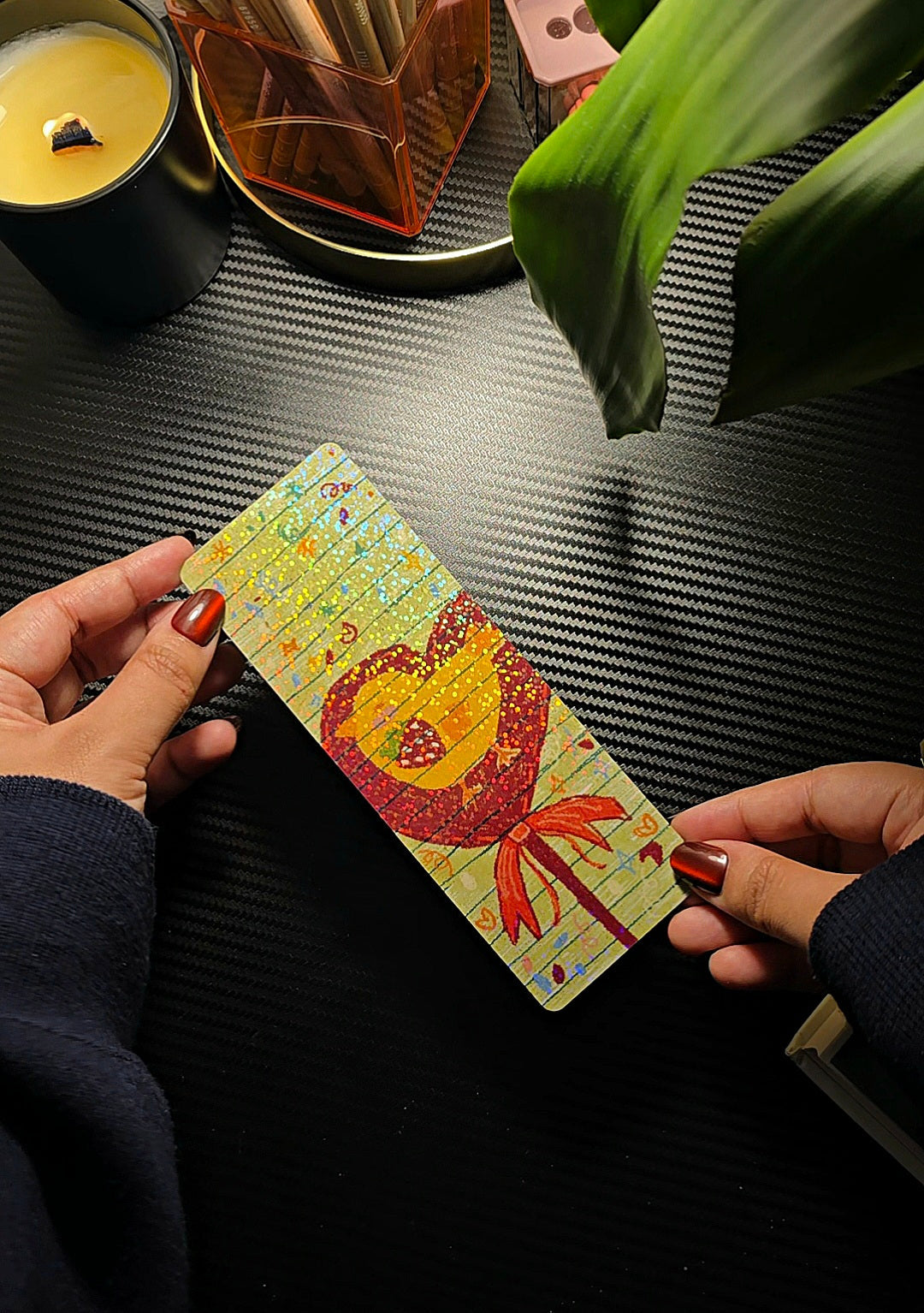 Sweet Chick holographic bookmark held in hands showing sparkly holographic finish and kawaii chick design