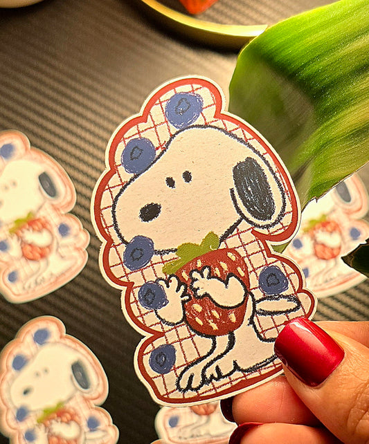 Berry Cute Snoopy die-cut sticker – Snoopy wearing a red plaid blueberry-print outfit, hugging a strawberry, matte vinyl, 2x3 inch