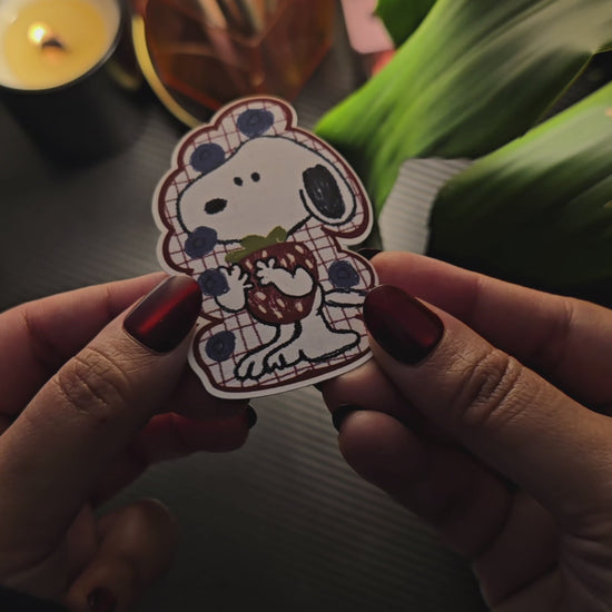 Berry Cute Snoopy die-cut sticker – Snoopy wearing a red plaid blueberry-print outfit, hugging a strawberry, matte vinyl, 2x3 inch